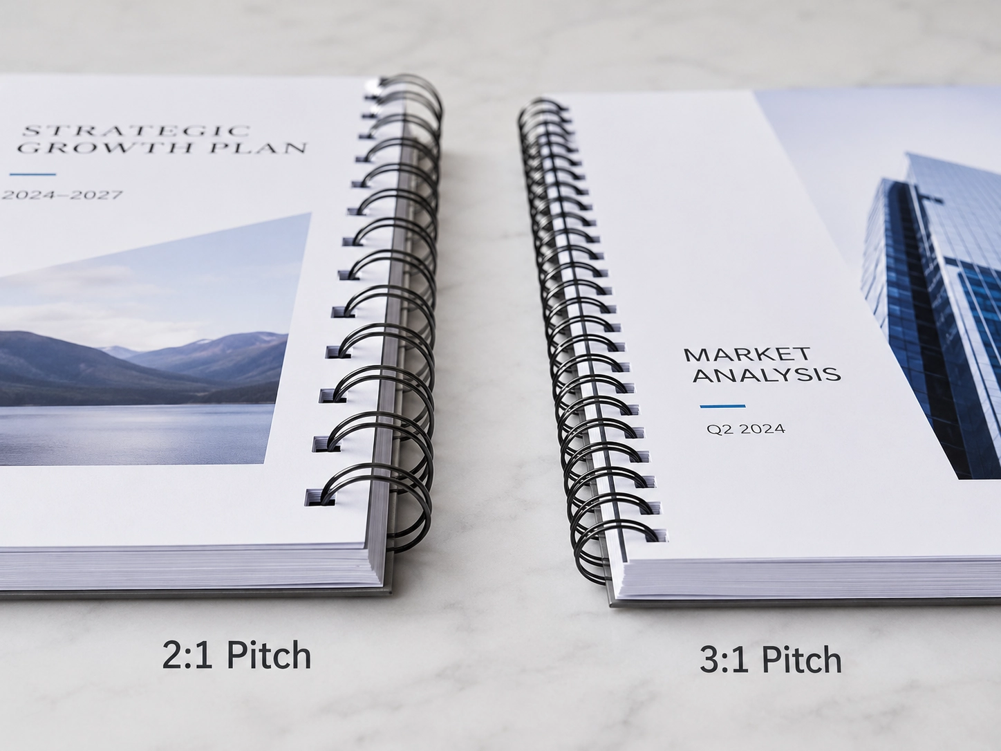 Close-up comparison of 2:1 and 3:1 pitch double-loop wire-o binding wire on professional documents